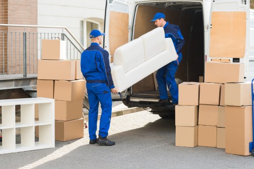 House removal team loading furniture for a Romford home move