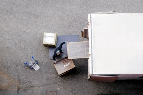 Furniture being carefully carried from a typical Romford home