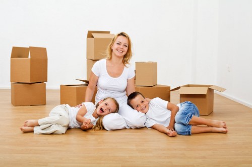 Loading household furniture into a van in Romford