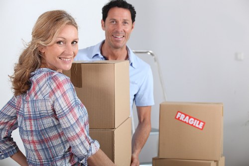 Packed boxes and wrapped furniture ready for removal in Romford
